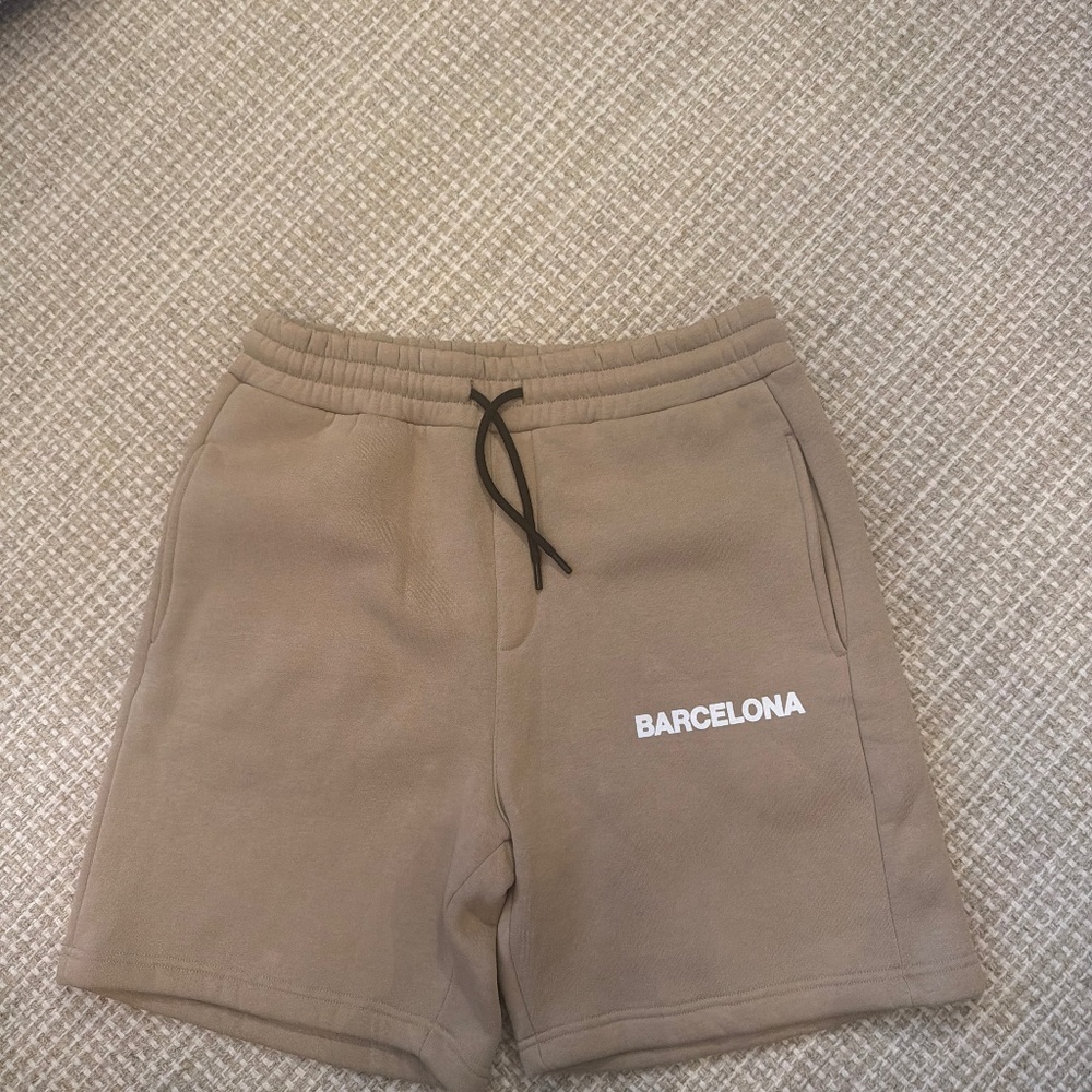 men’s City essentials, Barcelona shorts.